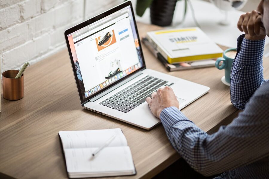 A student working at a laptop