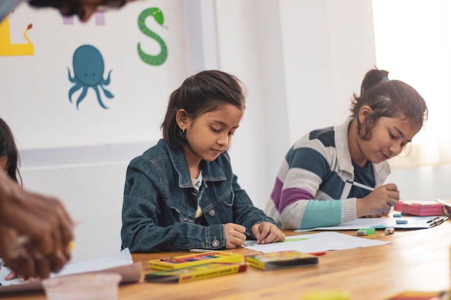 Two pupils working together at a classroom table